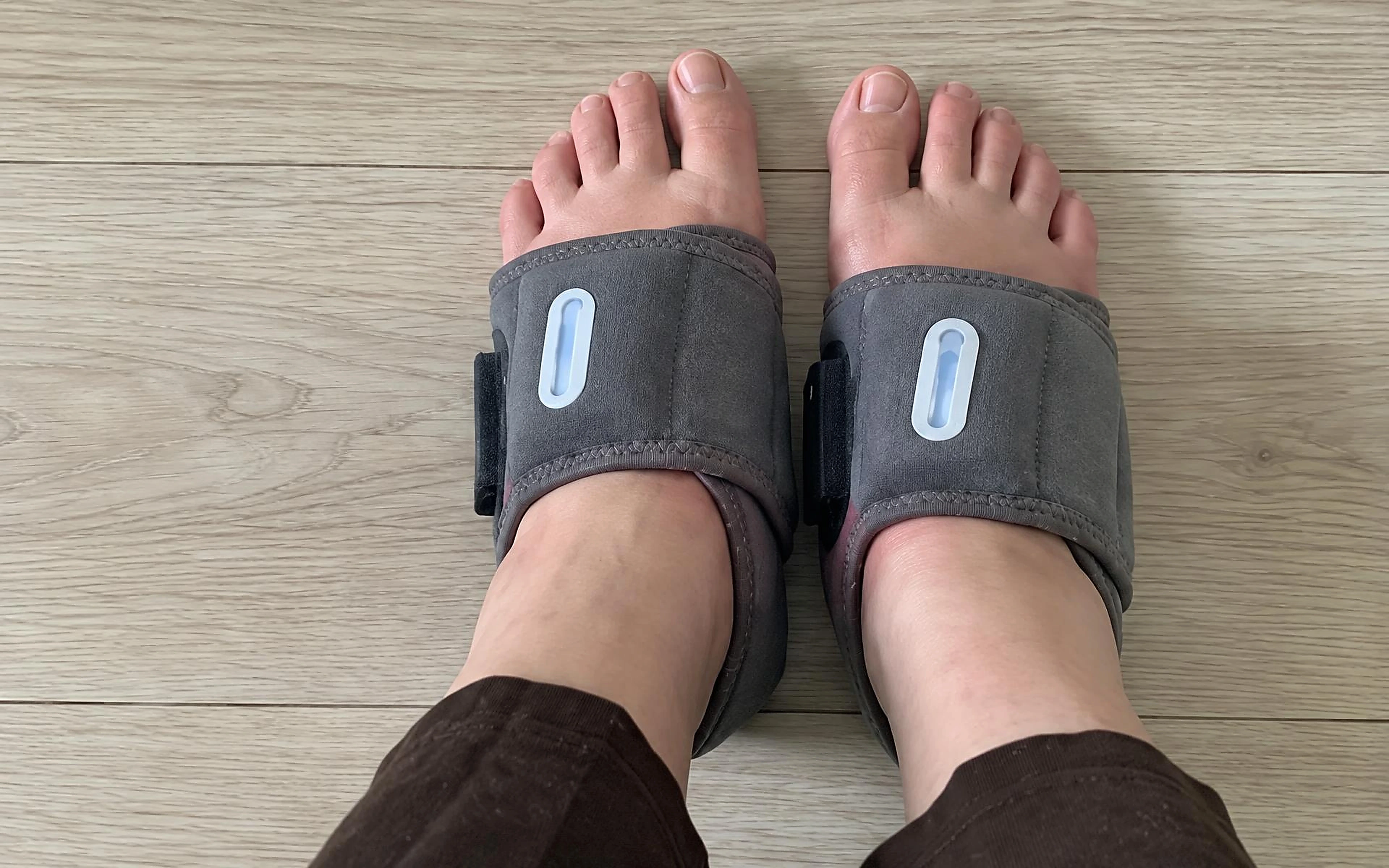 EMS massager wraps worn on both feet